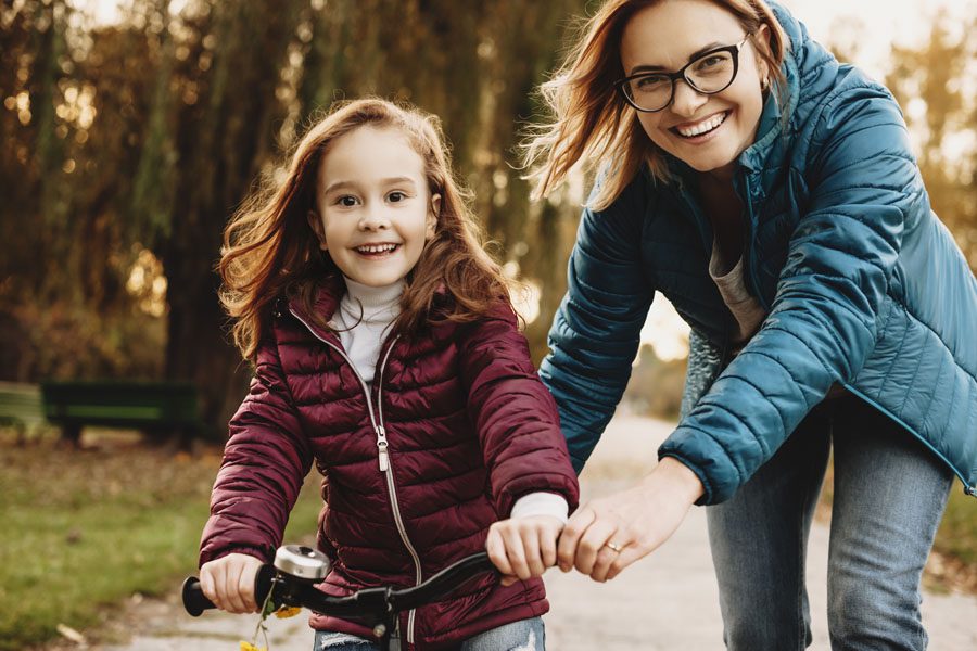 Personal Insurance - Mother and Daughter Learning How to Ride a Bike